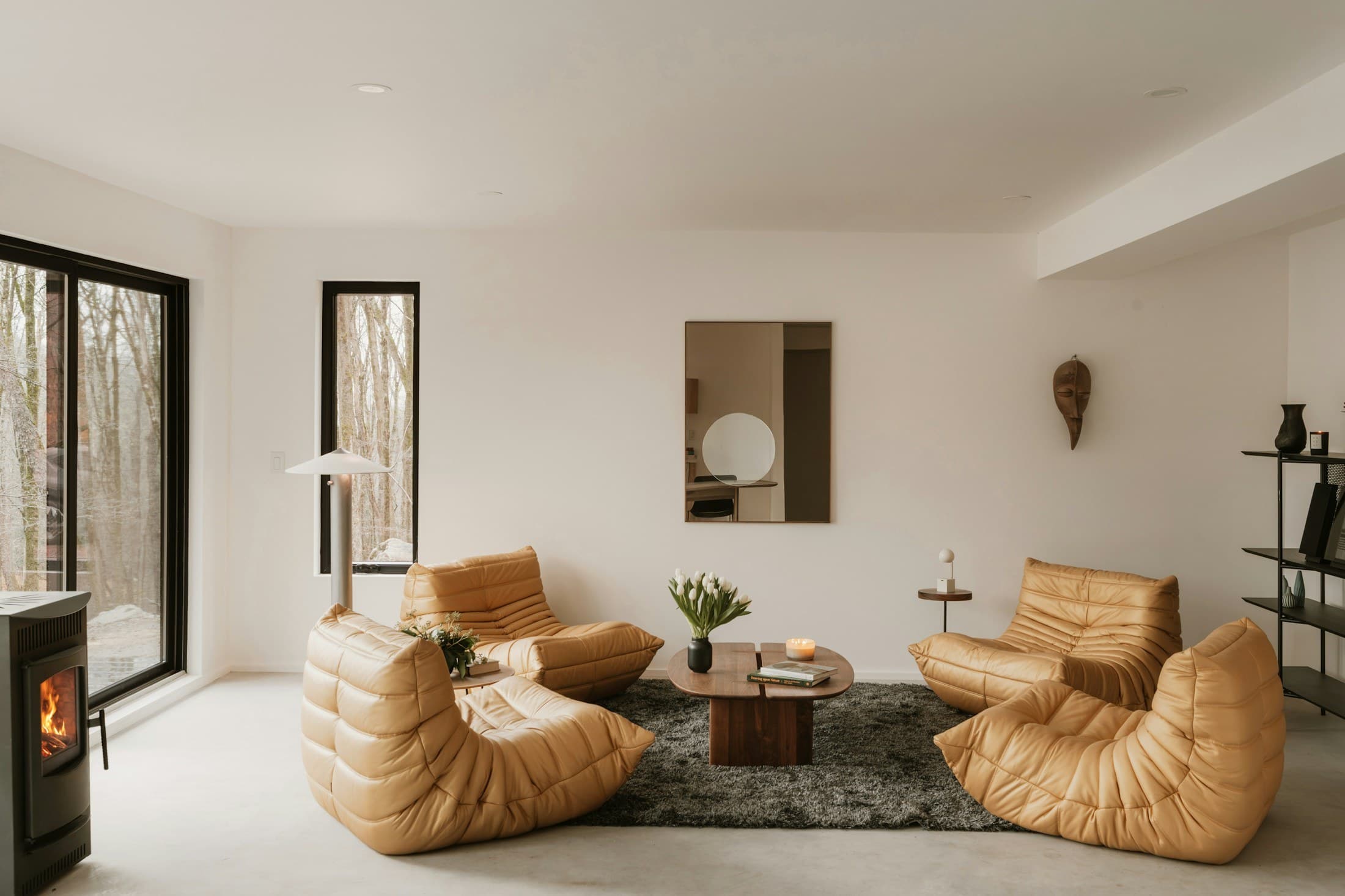 Modern living room with tan leather chairs and fireplace