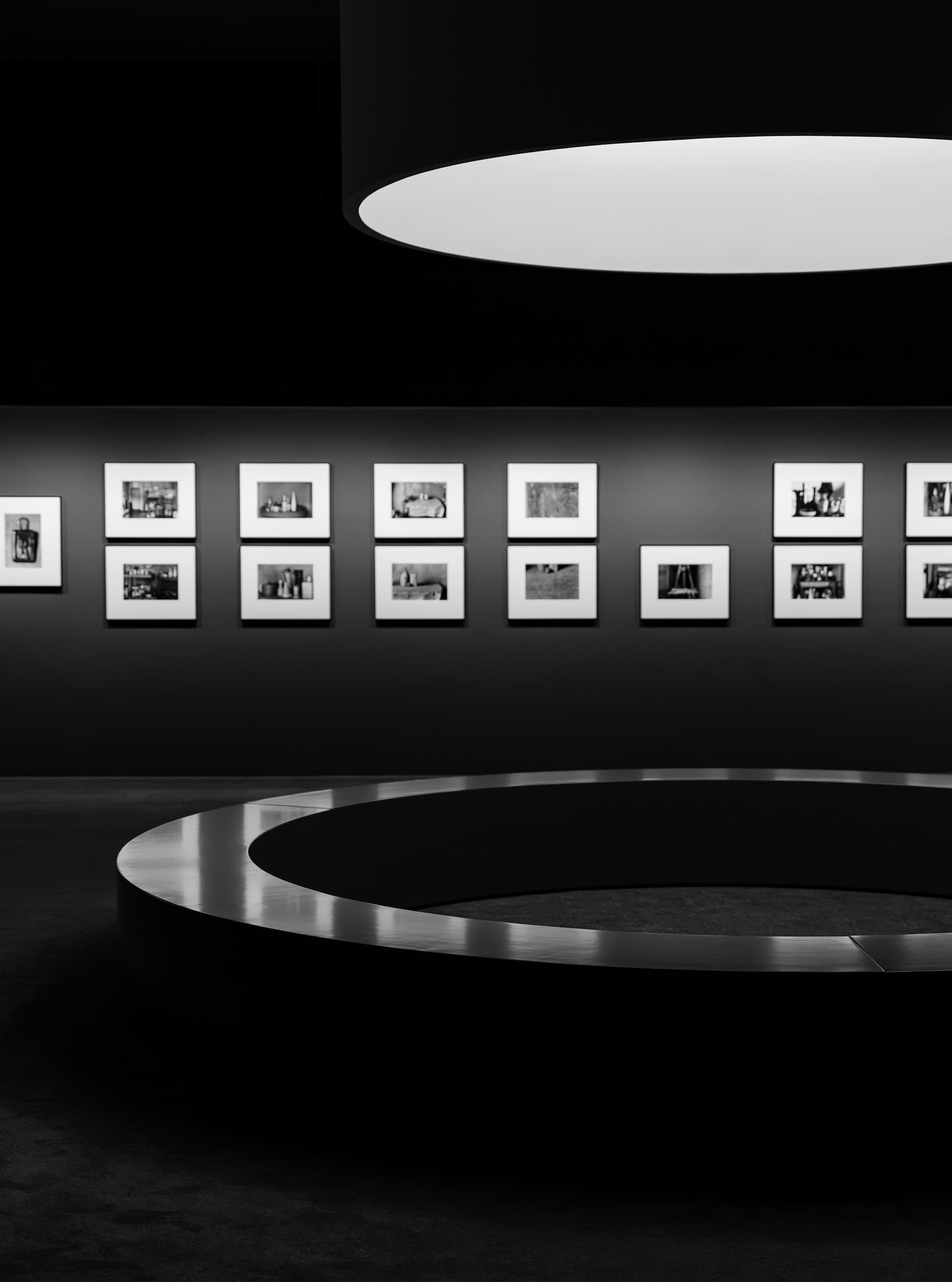 Dark modern art gallery with black and white photographs